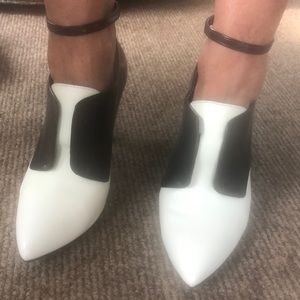 Black and white ankle strap boot with high heel.
